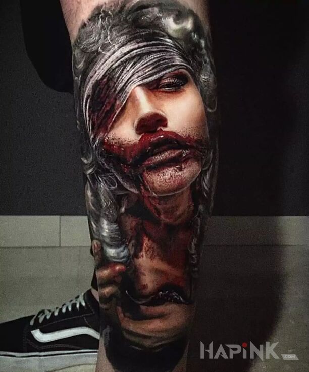 Tattoo Konkretnie poturbowana in faces motif and realistic style on the tibia