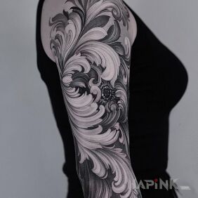 Tattoo Whimsical flower on the upper arm motif: flowers style: graphic / illustrative