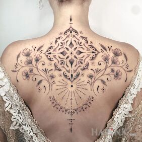 Tattoo Beautiful composition on the shoulder blades motif: ornaments style: graphic / illustrative