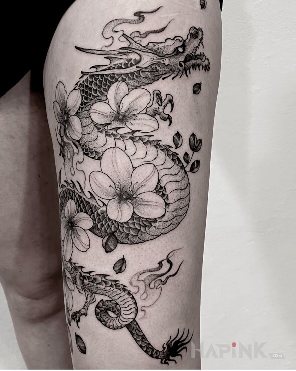 Tattoo Smok / Kwiaty in fantasy motif and graphic / illustrative style on the leg