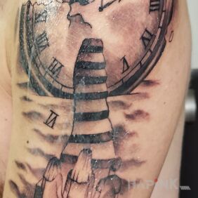 Tattoo Clock with stairs on the upper arm motif: black and gray style: realistic