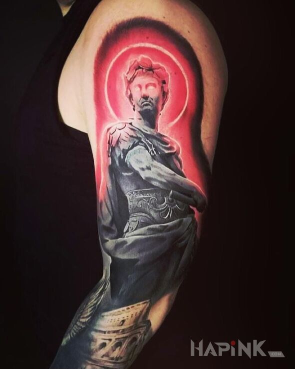 Tattoo Grek in colorful motif and realistic style on the upper arm