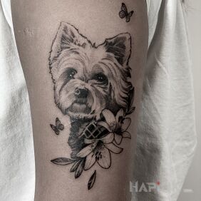 Tattoo Dog / Pet / Friend on the upper arm motif: flowers style: realistic