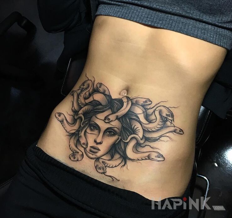 Tattoo Meduza in characters motif on the stomach