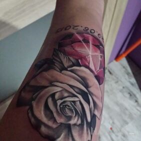 Tattoo My on the forearm motif: flowers