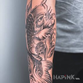 Tattoo Japanese fish on the forearm motif: flowers style: japanese / irezumi