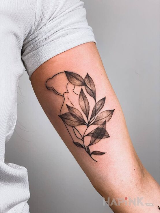 Tattoo Female in black and gray motif and contour / linework style on the bicep