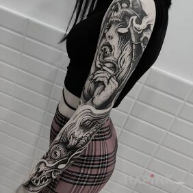 Tattoo Vampire with a long tongue on the upper arm motif: demons style: graphic / illustrative