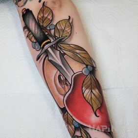 Tattoo Dagger / Apple On the arm motif: objects style: neo-traditional