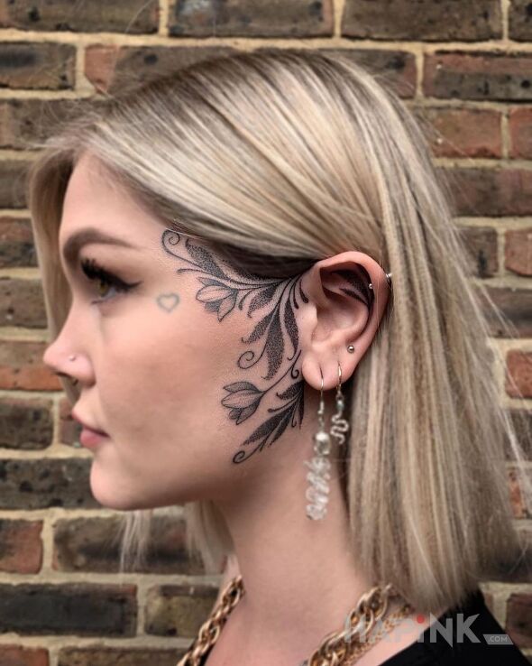 Tattoo Z kwiatami ci do twarzy in flowers motif and graphic / illustrative style on the face
