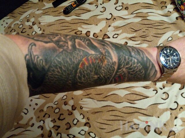 Tattoo Chiński smok in dragons motif and japanese / irezumi style On the arm