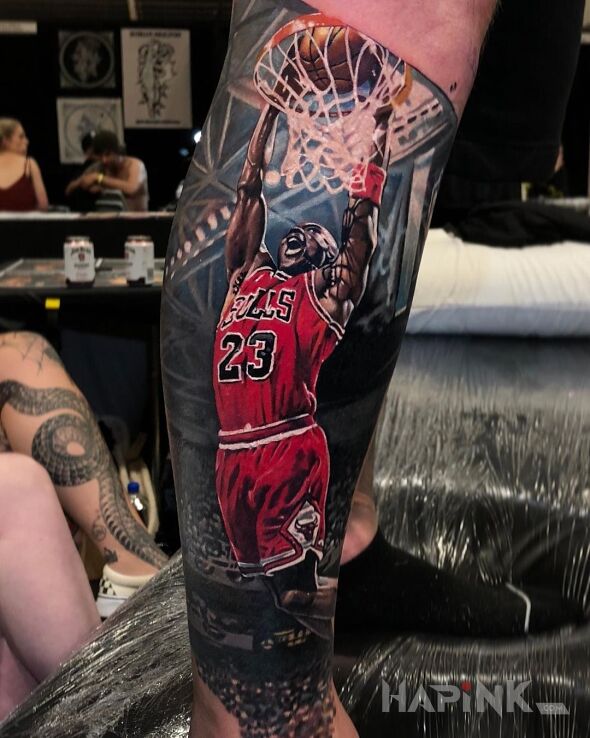 Tattoo Wsad in colorful motif and realistic style on the calf