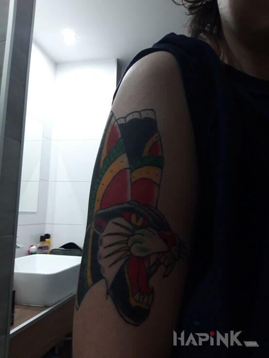 Tattoo Pantera in colorful motif and oldschool style on the upper arm