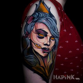 Tattoo Woman on the upper arm motif: faces style: neo-traditional