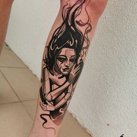 Tattoo Woman on the leg motif: black and gray style: graphic / illustrative
