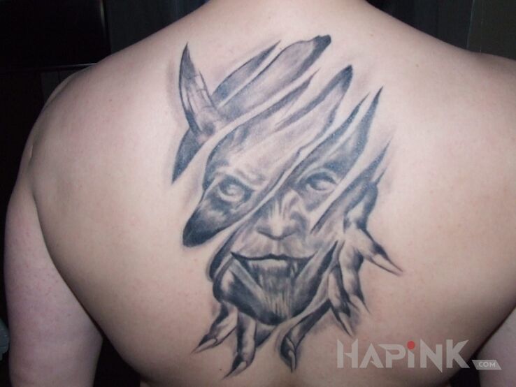 Tattoo Moj autoportret in demons motif on the back