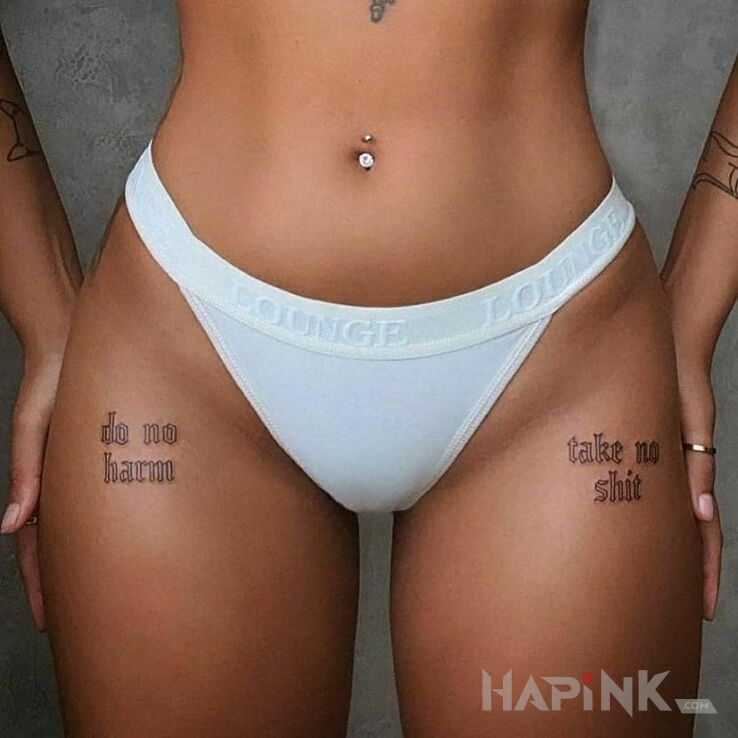 Tattoo Dwie sprawy in lettering motif and calligraphy style on the thigh