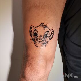Tattoo Simba on the leg motif: black and gray style: graphic / illustrative
