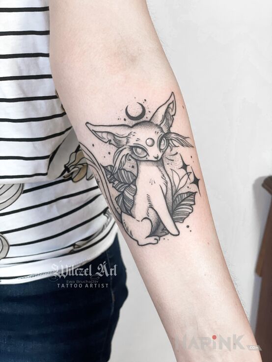 Tattoo Pokemon / Espeon in black and gray motif and graphic / illustrative style On the arm