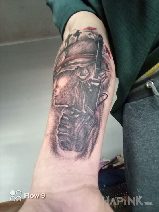 Tattoo New in black and gray motif and realistic style on the forearm
