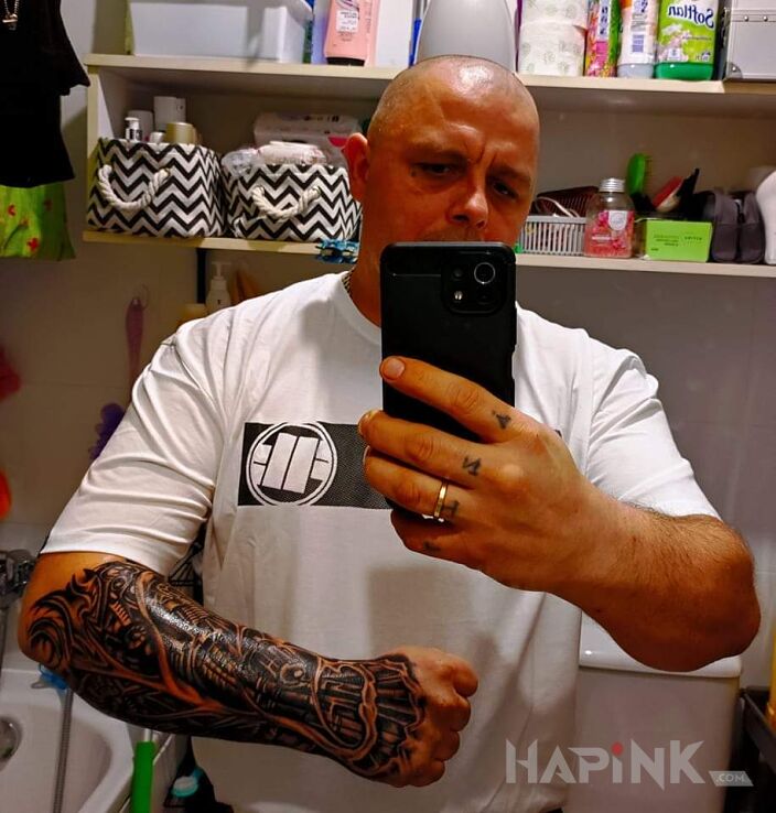 Tattoo Początek ręki in ripped skin motif and biomechanics style on the forearm