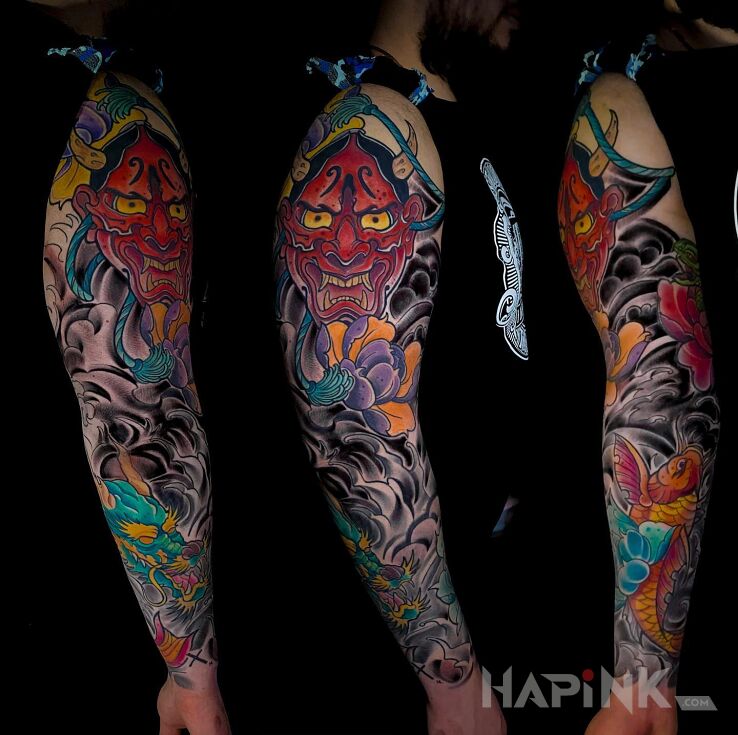 Tattoo JAPONIA in colorful motif and japanese / irezumi style on the upper arm