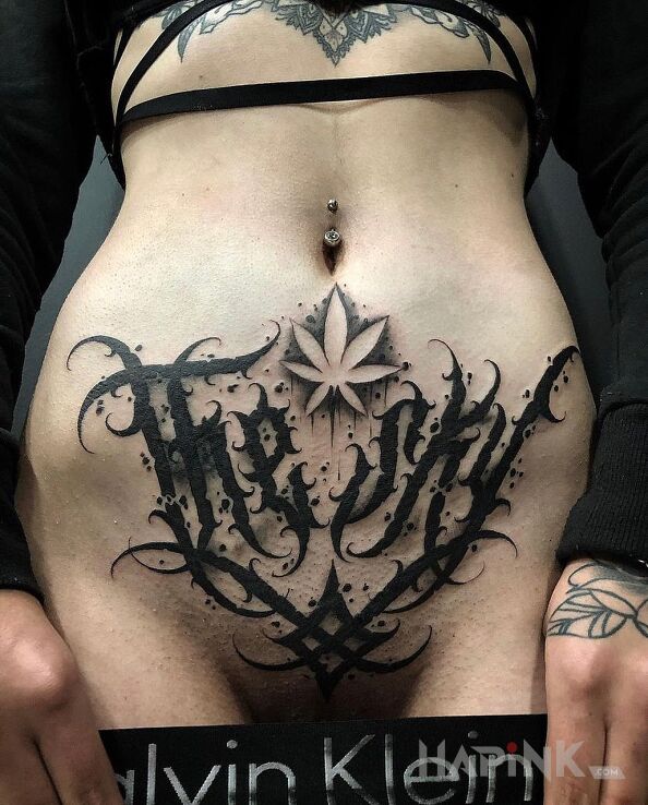 Tattoo Nieśmiała in sexy motif and blackwork / blackout style on the stomach