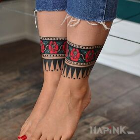 Tattoo Red roses in bands on the leg motif: flowers style: oldschool