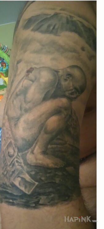 Tattoo Upadły anioł  in realistic style on the upper arm