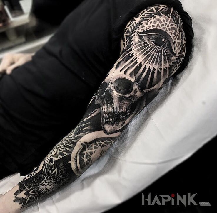 Tattoo Mroczny rękaw in skulls motif and dotwork style on the forearm