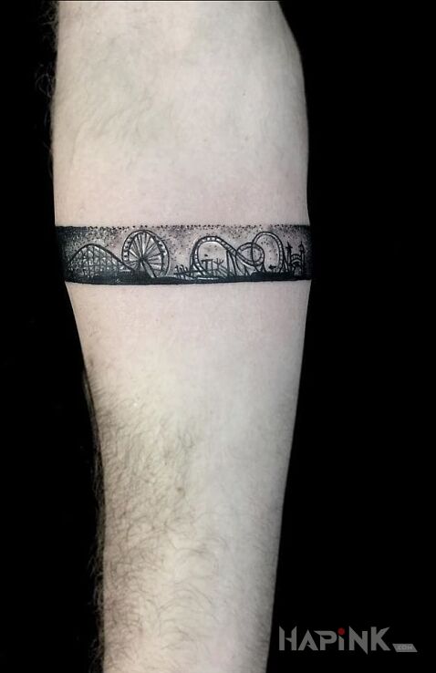 Tattoo Wesole miasteczko in other motif on the forearm
