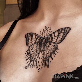 Tattoo Butterfly on the chest motif: black and gray style: graphic / illustrative