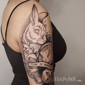 Tattoo Rabbit on the upper arm motif: animals style: graphic / illustrative
