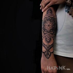 Tattoo Mandala on the forearm motif: ornaments style: contour / linework