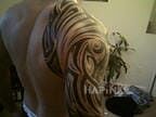 Tattoo Tribal in tribal style on the upper arm