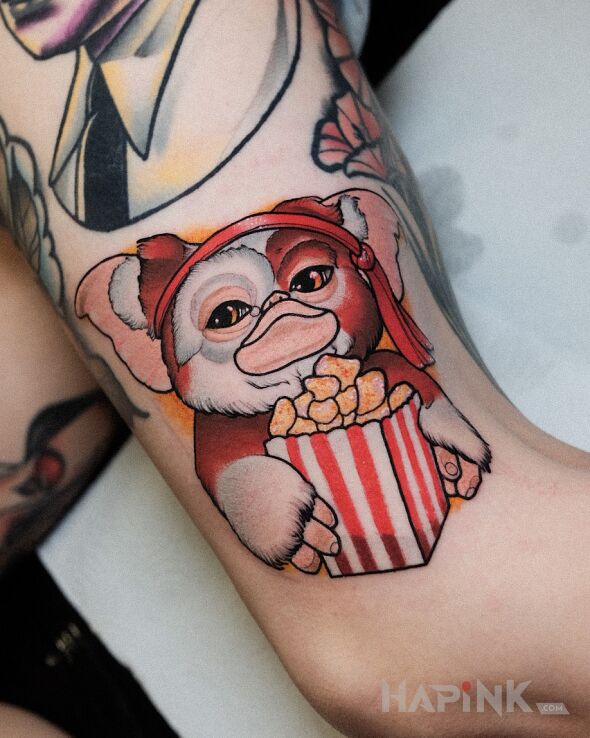Tattoo Gizmo / Gremliny in fantasy motif and neo-traditional style on the thigh