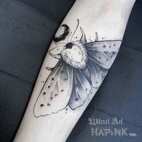 Tattoo Moth / Moon On the arm motif: black and gray style: graphic / illustrative