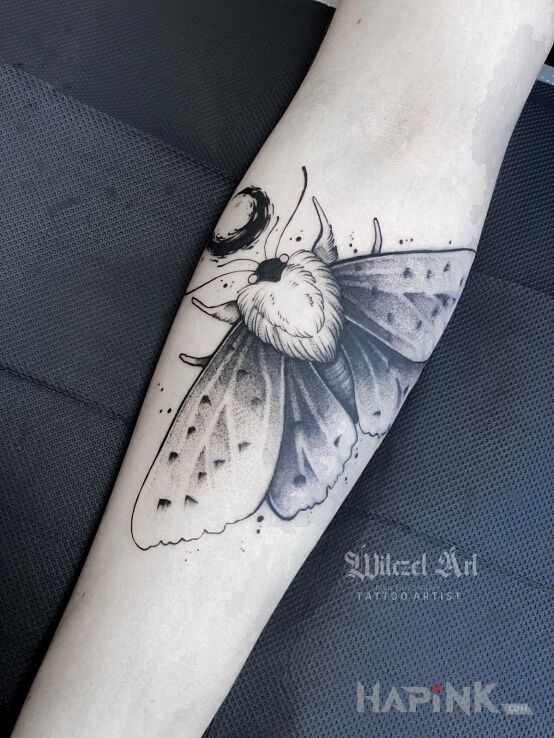 Tattoo Ćma / Księżyc in black and gray motif and graphic / illustrative style On the arm
