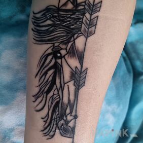Tattoo Arrow with a horse head On the arm motif: animals style: graphic / illustrative