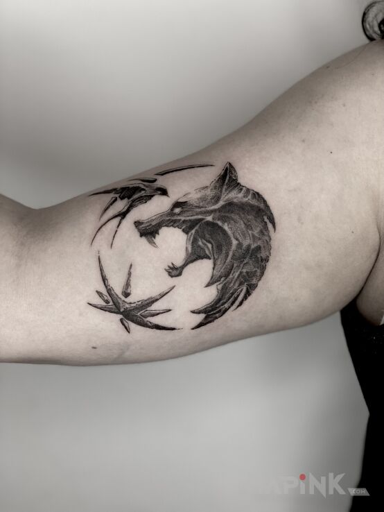 Tattoo Wiedźmin / The Witcher in animals motif and graphic / illustrative style on the bicep