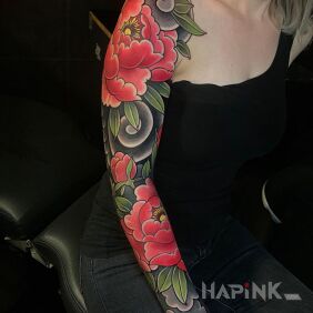 Tattoo Red peonies on the upper arm motif: flowers style: japanese / irezumi