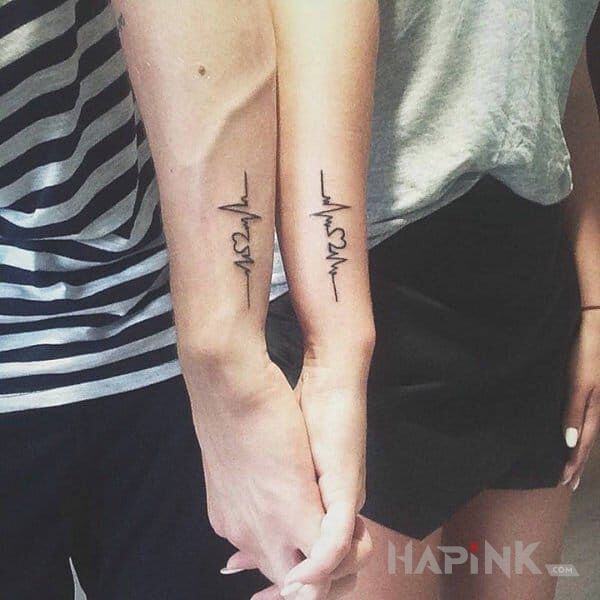 Tattoo Dla pary in Love motif on the forearm