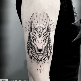 Tattoo Anubis on the upper arm motif: characters style: graphic / illustrative