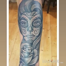 Tattoo Girl with muerte makeup On the arm motif: black and gray style: graphic / illustrative