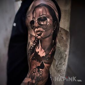 Tattoo Bicycle Girl on the upper arm motif: 3D style: realistic