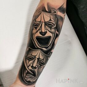 Tattoo Theatrical masks on the forearm motif: faces style: realistic