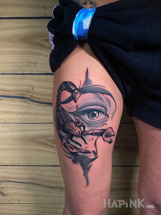 Tattoo Skorpion in zodiac signs motif and realistic style on the thigh