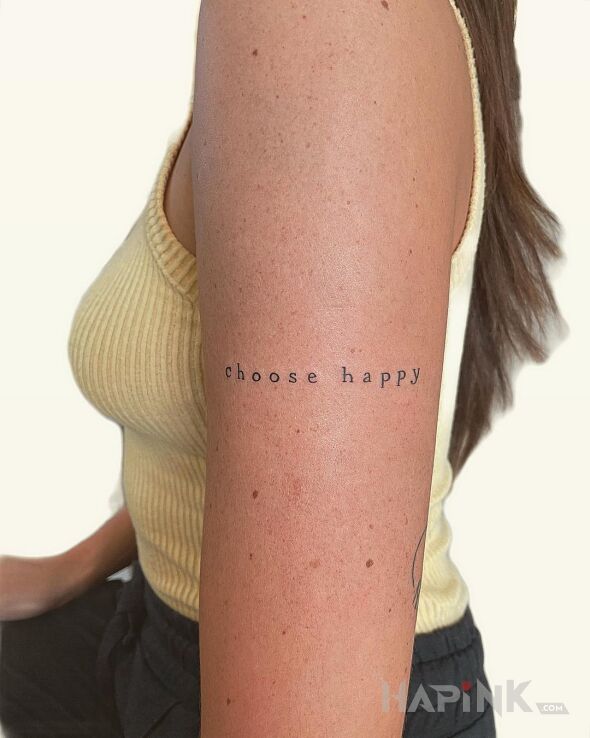 Tattoo Wybierz szczęście in lettering motif and minimalistic style On the arm