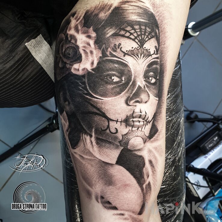 Tattoo Santa Muerte - Święta Śmierć in black and gray motif and realistic style on the bicep
