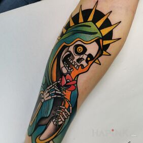 Tattoo Santa Muerte in color on the forearm motif: skulls style: neo-traditional